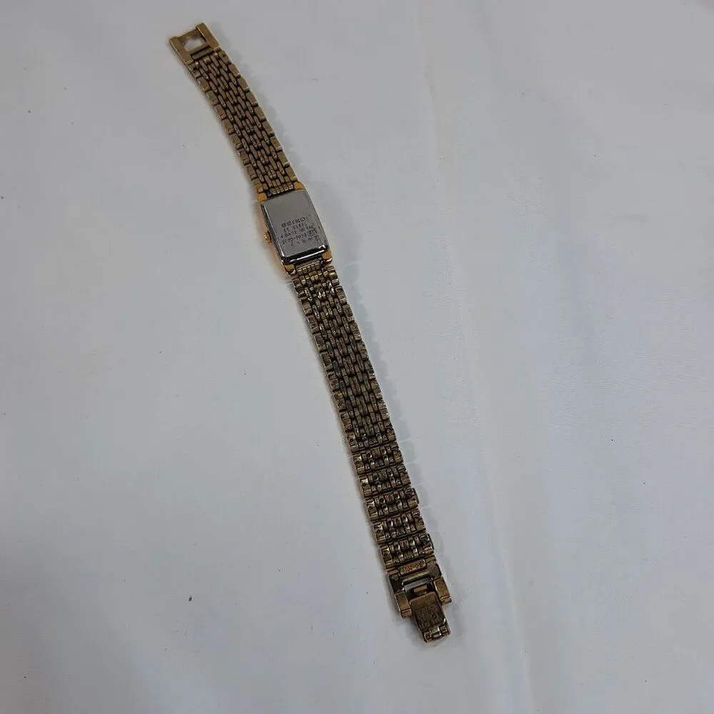 Vintage Seiko Watch Women Gold Tone Gold Dial Rectangle bracelet 2E20-7023 dress